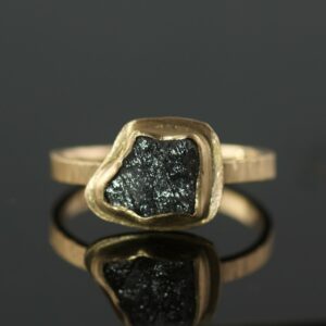 raw diamond black diamond in gold ring