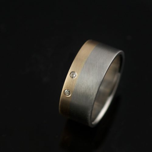 custom ring mixed metals wedding band with diamonds