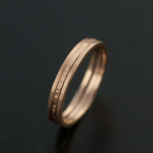 three thin rose gold rings hammered